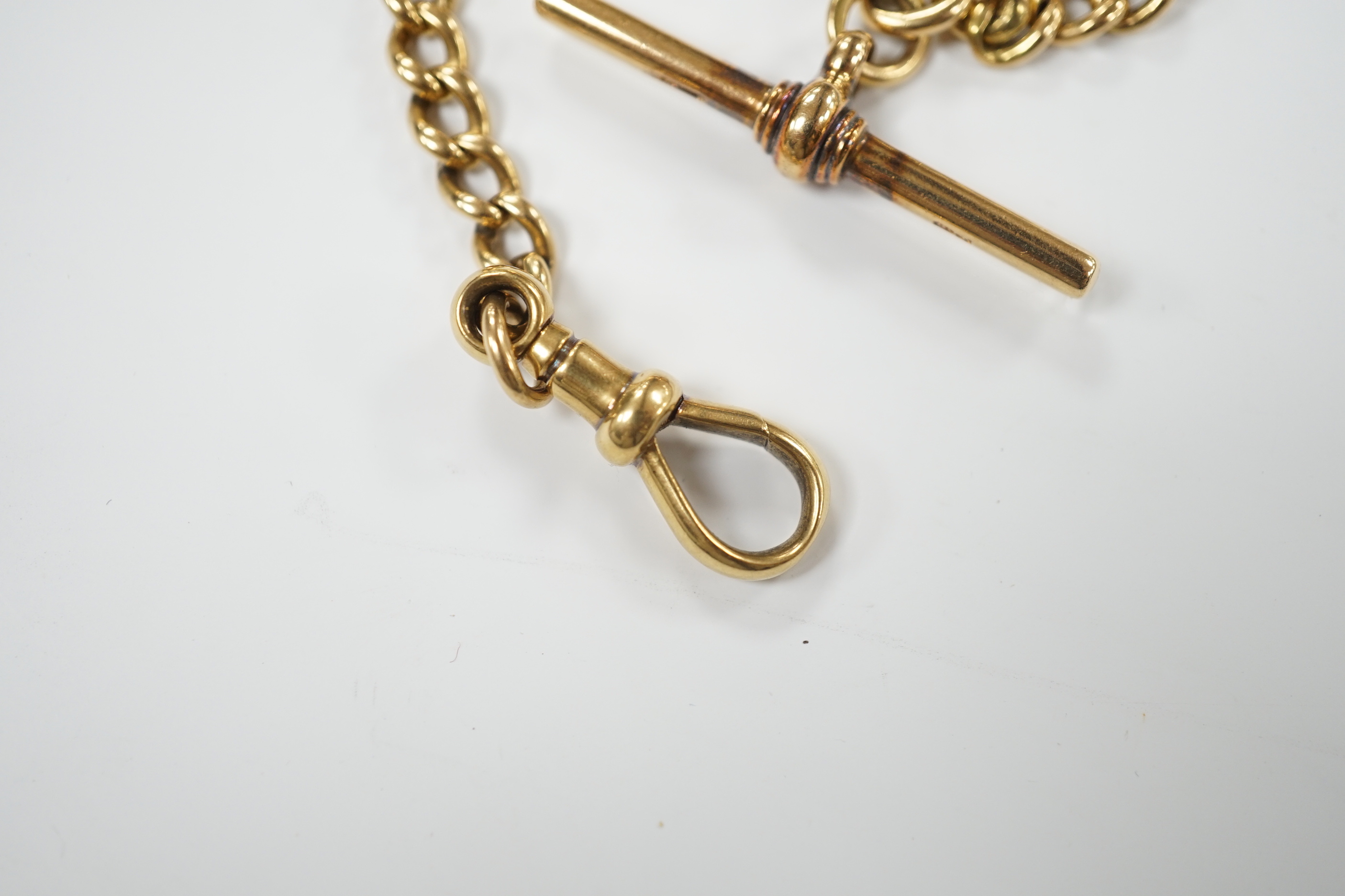 An 18ct gold curb link albert, 28cm